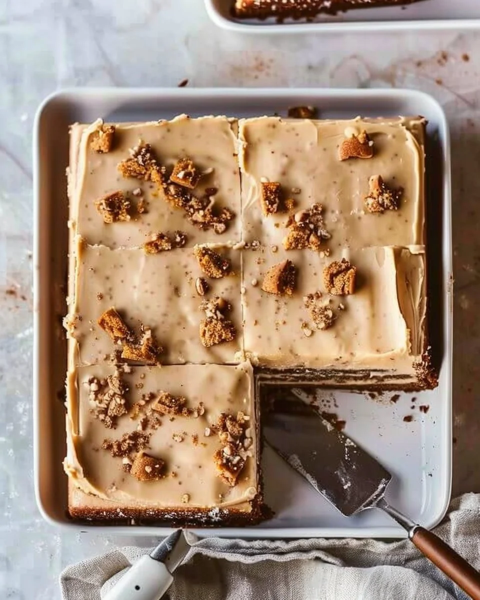 Delicious Pumpkin Texas Sheet Cake topped with cream cheese frosting.
